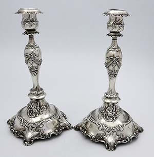Tiffany & Co antique sterling silver candlesticks with cast applied putti swags and bows